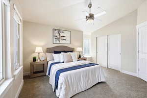 Bedroom with carpet floors, vaulted ceiling, a closet, and a ceiling fan
