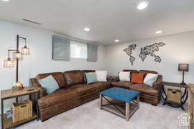 Living room featuring recessed lighting and carpet floors