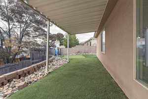 Fenced backyard featuring a patio area