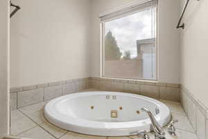 Bathroom with a tub with jets