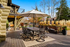 Deck featuring stairs and outdoor dining space