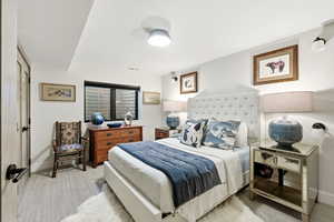 Bedroom with baseboards and carpet