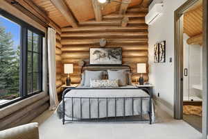 Bedroom featuring wooden ceiling, rustic walls, and a wall mounted AC