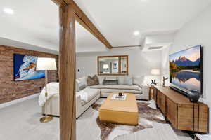 Living area featuring recessed lighting and carpet flooring