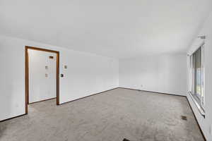 View of carpeted spare room