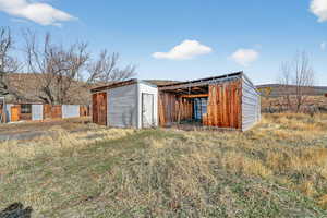 View of pole building featuring a storage shed
