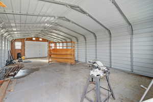 Garage featuring metal wall