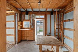 Misc room featuring unfinished concrete floors