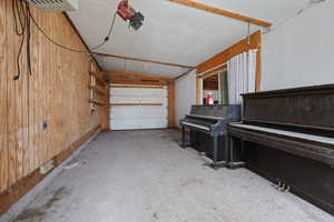 Garage featuring wooden walls