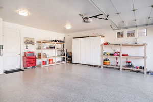 Garage featuring a garage door opener