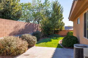 Fenced backyard with a patio area