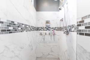 Bathroom with tiled shower