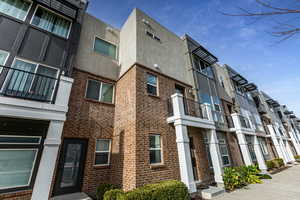 View of property with a residential view