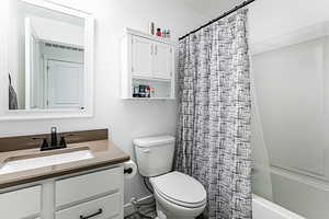 Full bath with vanity and shower / bath combo