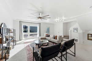 Living area featuring carpet floors, a ceiling fan, and rail lighting