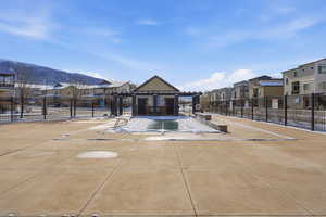 Surrounding community with a patio area, a residential view, and a pergola