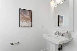 Bathroom with baseboards and a sink