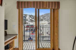 Doorway to outside featuring a mountain view