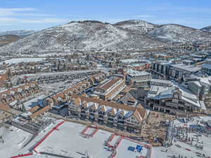 Snowy aerial view featuring a mountain view