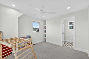 Rec room featuring light carpet, recessed lighting, and ceiling fan