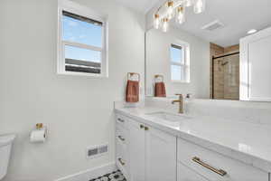Full bath featuring vanity and a stall shower