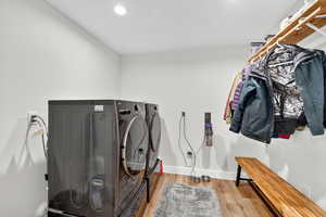 2nd Laundry Room with wood finished floors, recessed lighting, and separate washer and dryer