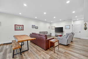 2nd Living room with recessed lighting and light wood-type flooring