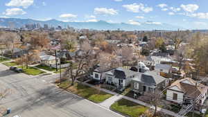 Aerial perspective of suburban area featuring a mountainous background