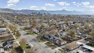 Aerial perspective of suburban area featuring a mountain backdrop