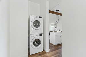 Laundry room featuring wood finished floors and stacked washer / dryer- Washer/Dryer have been digitally added