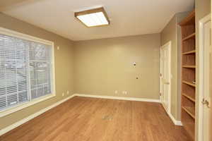 This room has an attached 3/4 bathroom and a large walkin closet and can be used as a main floor bedroom or an office