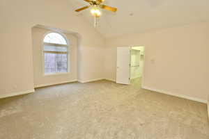 Bedroom #3 featuring high vaulted ceiling, and ceiling fan and large walk-in closet