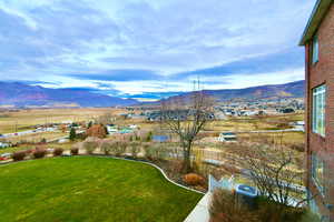 View from main level deck of mountain background with rural landscape