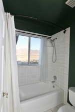 Large full bathroom with a double vanity with the toilet, tub/shower in a separate room. Valley views.