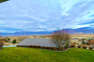 View from main level deck of mountain background with rural landscape