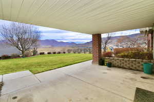 View of patio / terrace with a mountain view