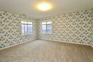 Spacious en-suite bedroom #5 with large view windows, a walk-in closet and a private bathroom