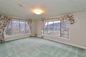 Spacious en-suite bedroom #7 with huge windows that capture the valley and mountain views
