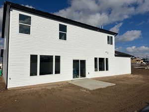 Back of house with a patio area