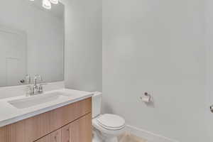 Bathroom with vanity and baseboards