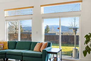 Living room with a mountain view and plenty of natural light