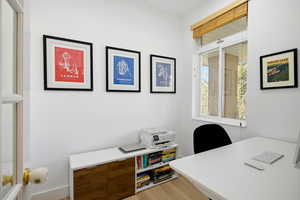 Office area with light wood-style floors