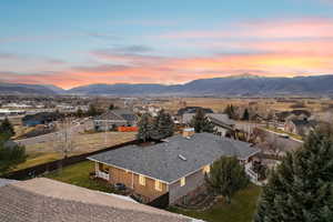 Aerial view of residential area featuring a mountain backdrop