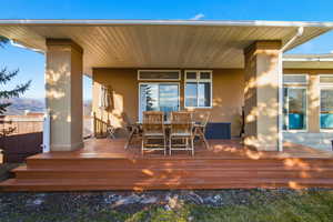 Wooden deck featuring outdoor dining space