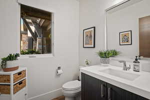 Bathroom with toilet and vanity