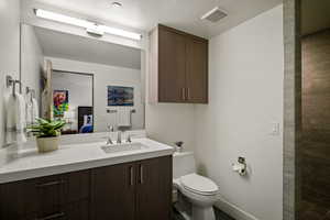 Bathroom featuring vanity and ensuite bathroom