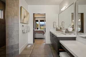 Bathroom with ensuite bath and vanity