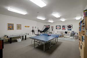 Game room with carpet flooring