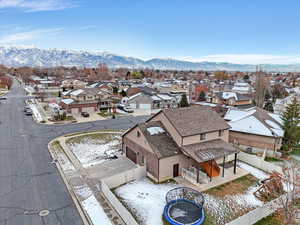 Aerial perspective of suburban area with a mountainous background