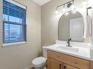 Half bath with vanity and toilet